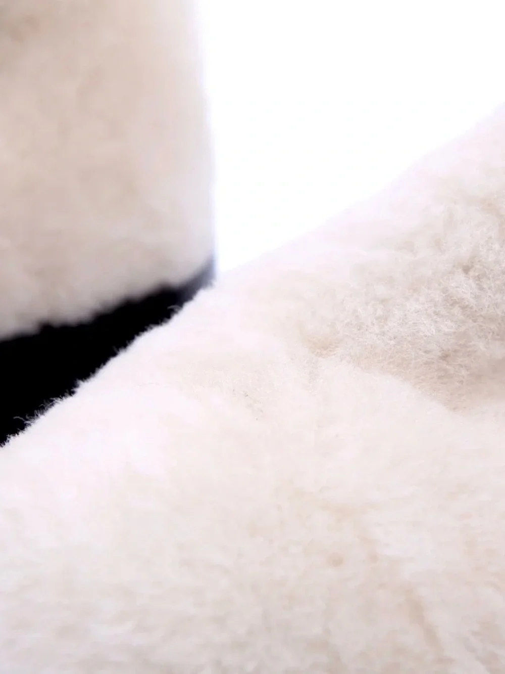 CHANEL Cream Shearling Ankle Boots with Black Leather Trim